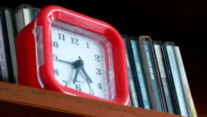 Red alarm clock with hands, May 2024 01 by Chenspec, Wikimedia Commons, CC BY SA 4.0